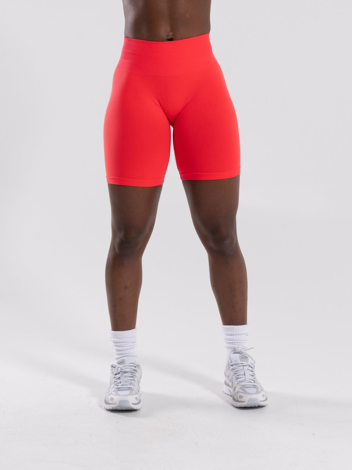 Pump Mid Rise Biker Short - Neon Red | Alphalete