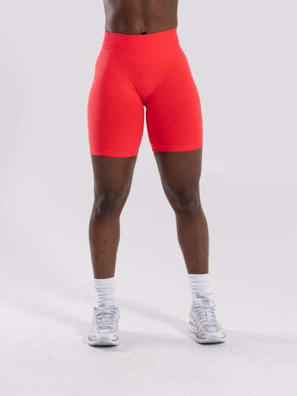 Pump Mid Rise Biker Short - Neon Red | Alphalete