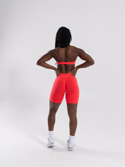 Pump Mid Rise Biker Short - Neon Red | Alphalete