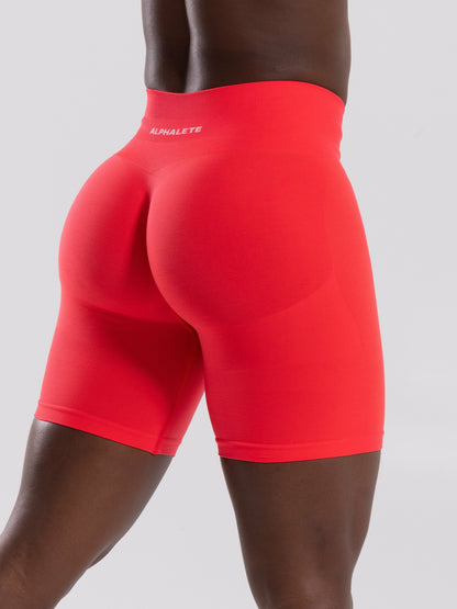 Pump Mid Rise Biker Short - Neon Red | Alphalete