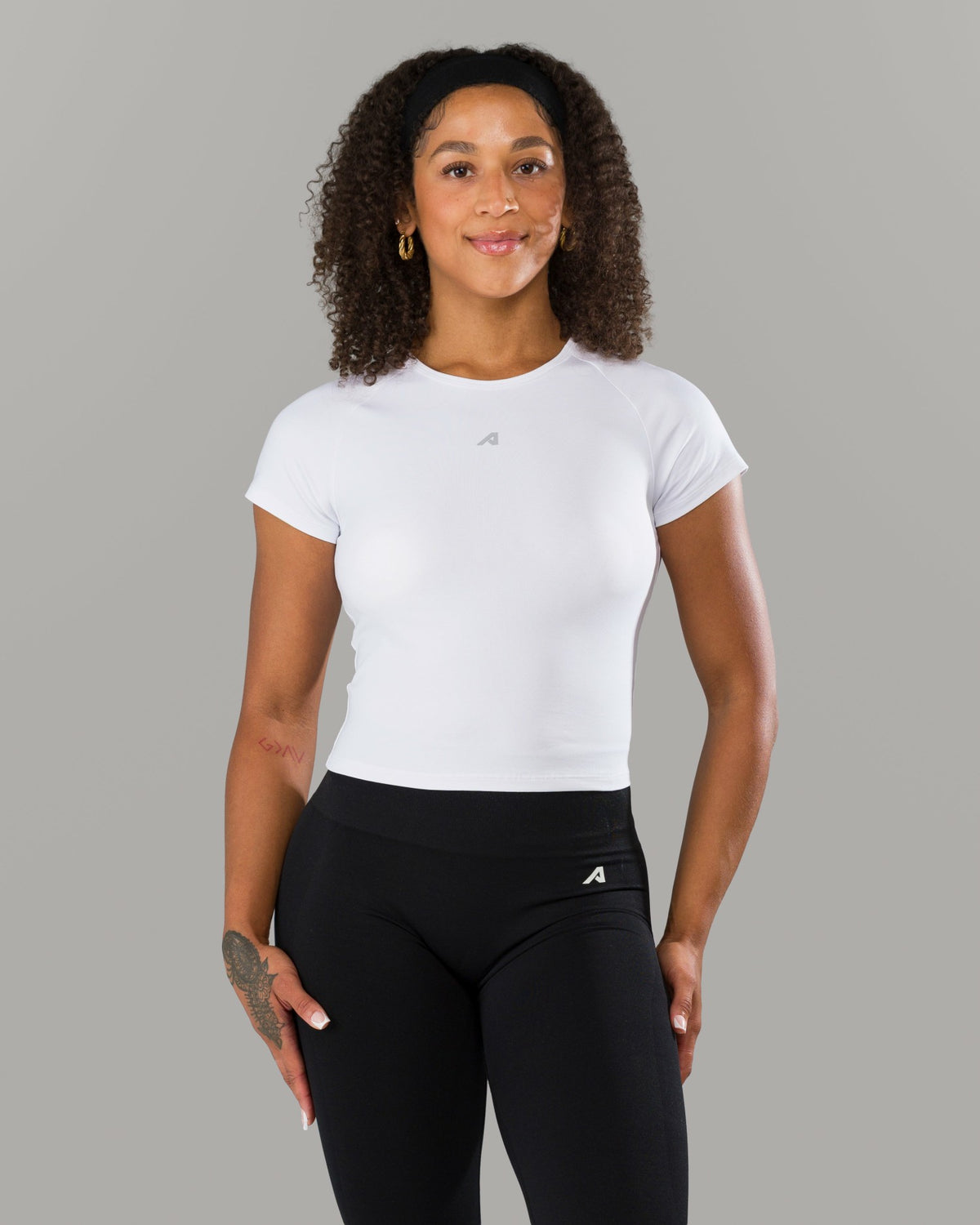Icon Baby Tee - White - Workout Clothes For Women | Alphalete