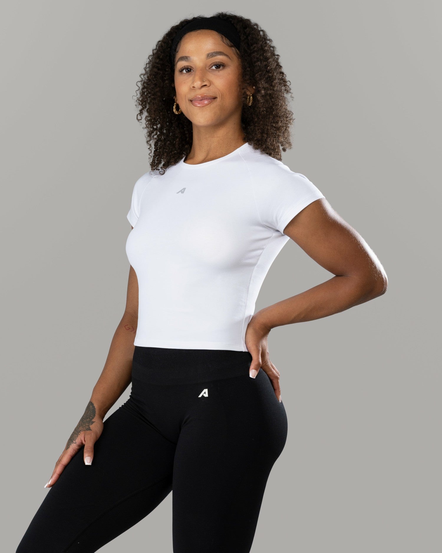 Icon Baby Tee - White - Workout Clothes For Women | Alphalete