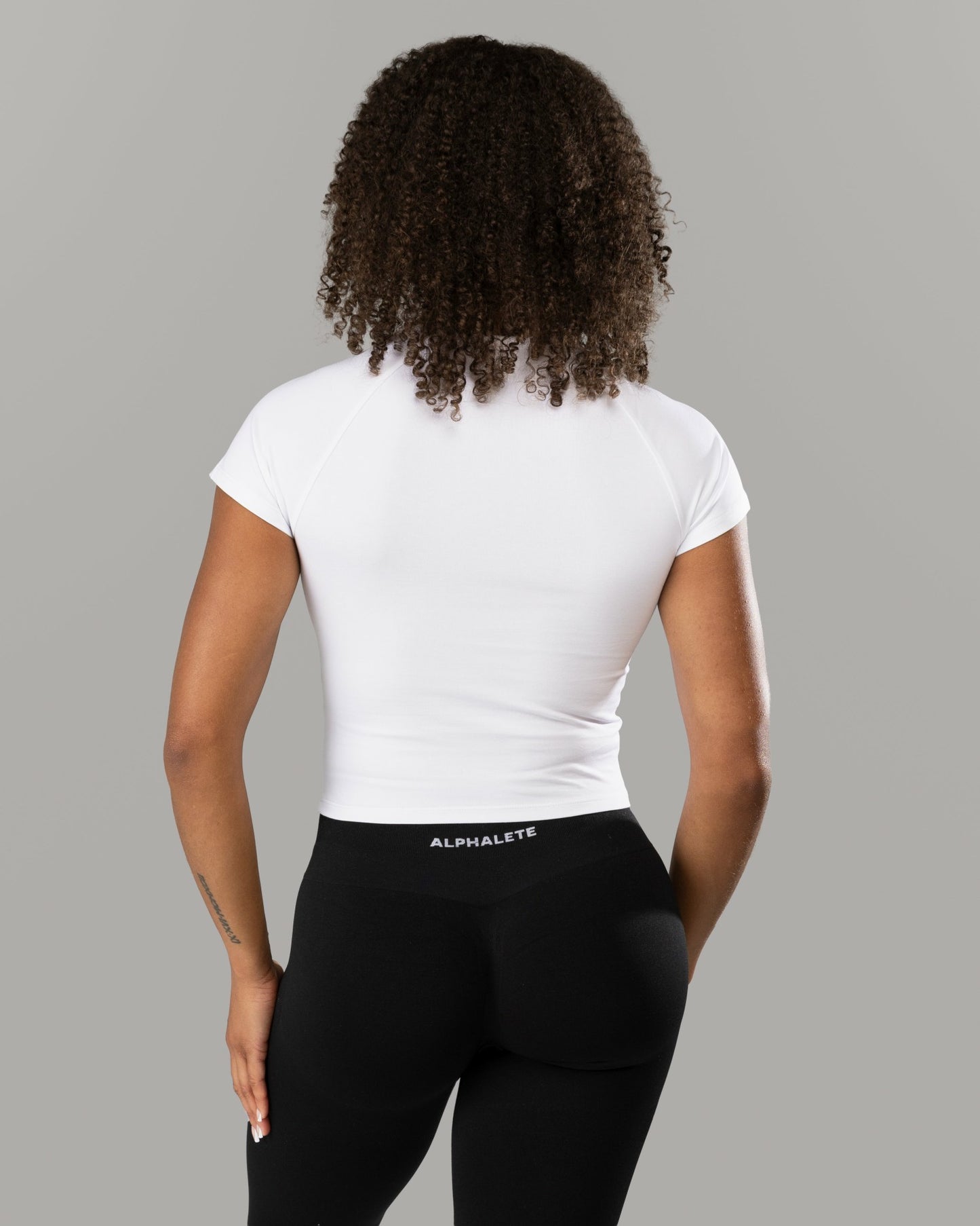 Icon Baby Tee - White - Workout Clothes For Women | Alphalete