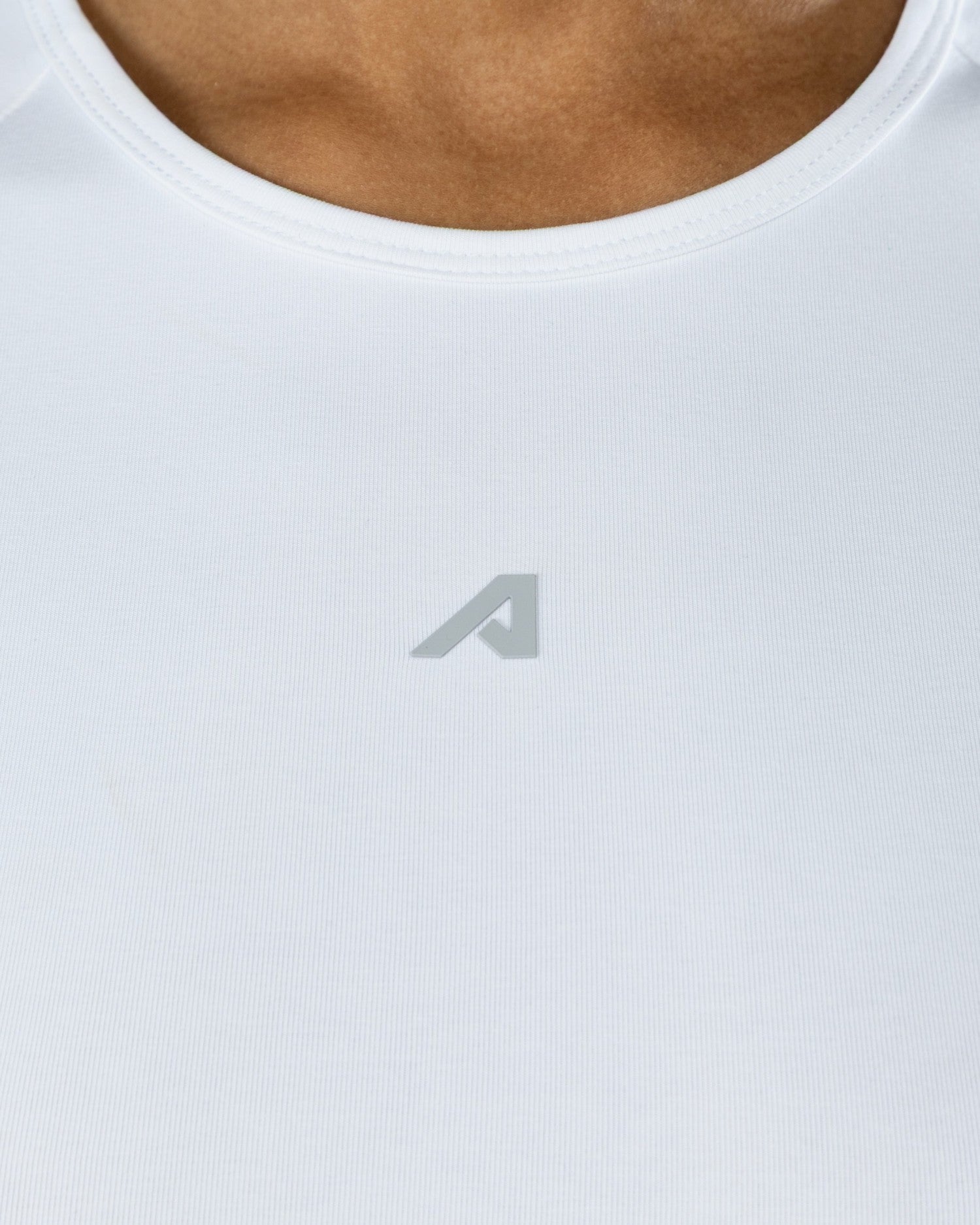 Icon Baby Tee - White - Workout Clothes For Women | Alphalete